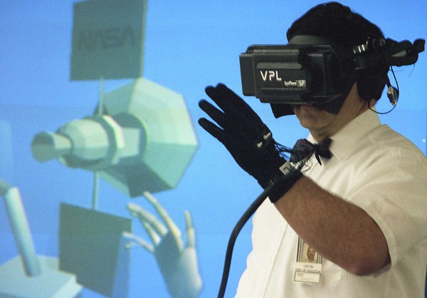 NASA scientist Bowen Loftin, working with a VPL virtual reality headset and gestures with a VPL DataGlove